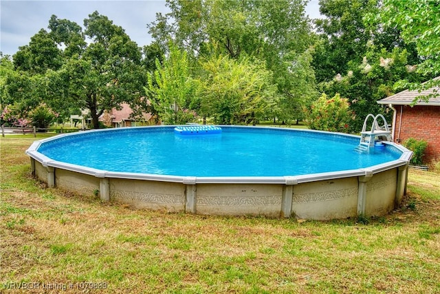298 Bayou Rd, Fort Gibson, OK 74434 - outdoor pool featuring a lawn