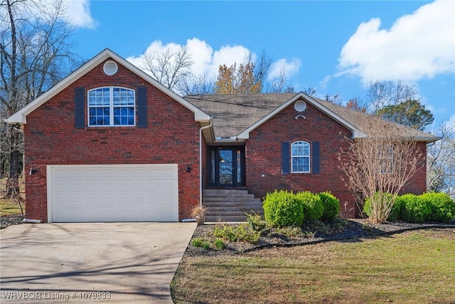 298 Bayou Rd, Fort Gibson, OK 74434 - view of front of home featuring brick siding, concrete driveway, and an attached garage