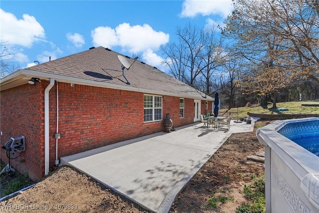 298 Bayou Rd, Fort Gibson, OK 74434 - back of house with a patio and brick siding