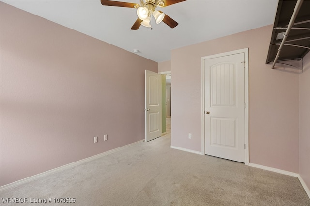 unfurnished bedroom with baseboards, carpet floors, and ceiling fan