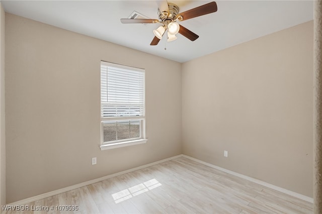 unfurnished room featuring a ceiling fan, baseboards, and light wood finished floors