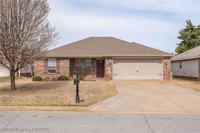 ranch-style home featuring a garage, brick siding, roof with shingles, and driveway