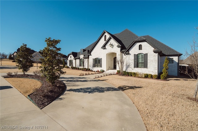 8801 Rombauer Pt, Fort Smith, AR 72916 - french country inspired facade featuring brick siding and concrete driveway