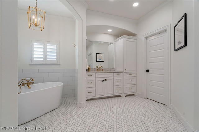 8801 Rombauer Pt, Fort Smith, AR 72916 - bathroom featuring recessed lighting, vanity, crown molding, and a freestanding tub