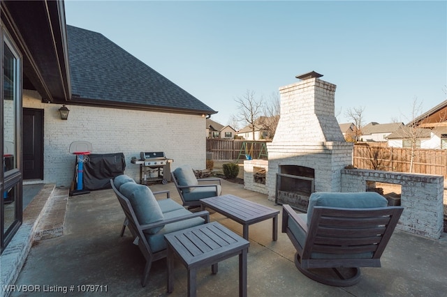 8801 Rombauer Pt, Fort Smith, AR 72916 - view of patio / terrace with grilling area, an outdoor living space with a fireplace, and fence