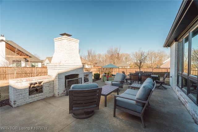 8801 Rombauer Pt, Fort Smith, AR 72916 - view of patio / terrace with outdoor dining area, a fenced backyard, and an outdoor fireplace