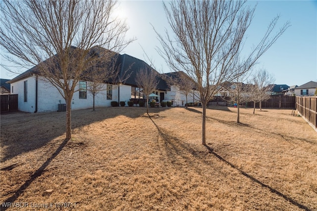 8801 Rombauer Pt, Fort Smith, AR 72916 - rear view of property featuring a yard and a fenced backyard