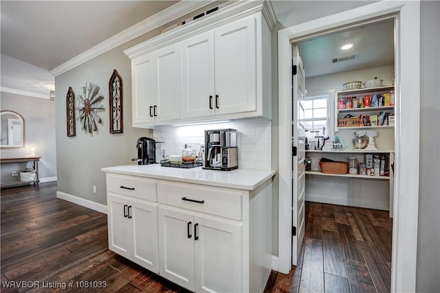 2803 Turtle Creek Dr, Lavaca, AR 72941 - bar with ornamental molding, dark wood-type flooring, decorative backsplash, and baseboards