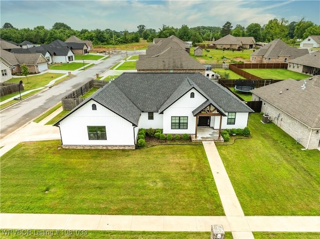 2803 Turtle Creek Dr, Lavaca, AR 72941 - view of front facade with a shingled roof, a residential view, and a front lawn