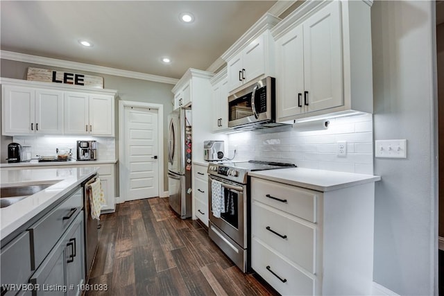 2803 Turtle Creek Dr, Lavaca, AR 72941 - kitchen featuring stainless steel appliances, light countertops, backsplash, ornamental molding, and white cabinetry