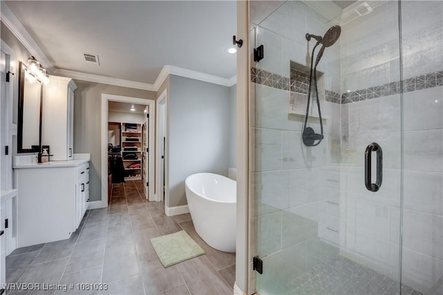 2803 Turtle Creek Dr, Lavaca, AR 72941 - bathroom with a walk in closet, vanity, a stall shower, crown molding, and a freestanding bath