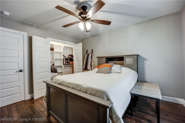 2803 Turtle Creek Dr, Lavaca, AR 72941 - bedroom with dark wood-style floors, a spacious closet, a closet, baseboards, and ceiling fan