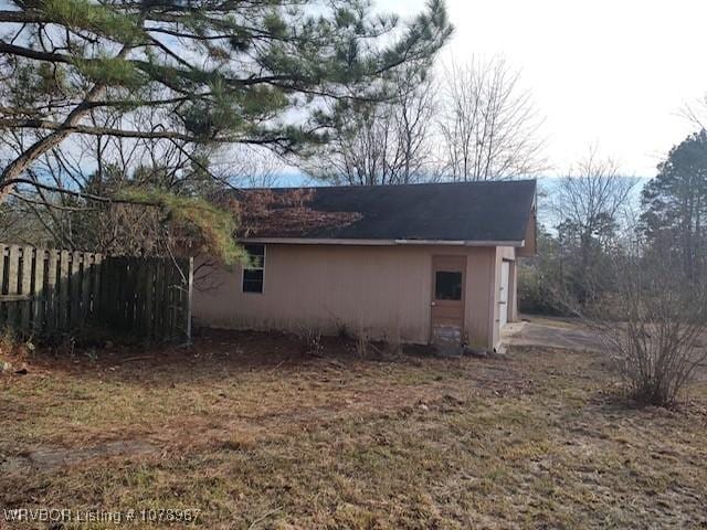 view of property exterior with a lawn