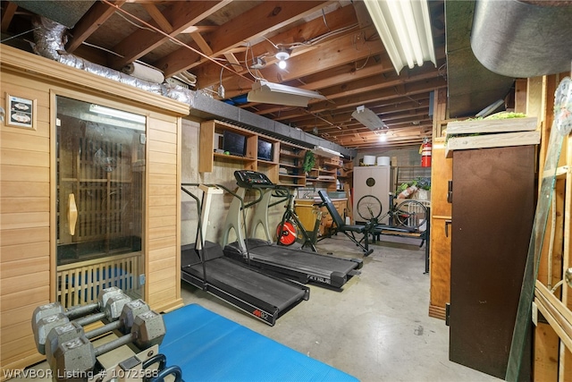 exercise room with wood walls