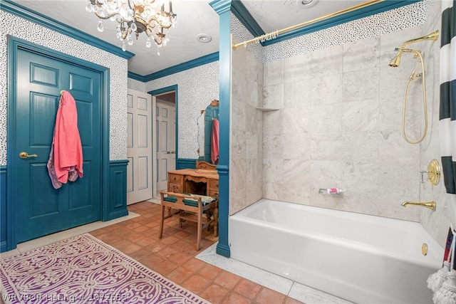 bathroom featuring bathtub / shower combination, tile patterned flooring, crown molding, and a notable chandelier