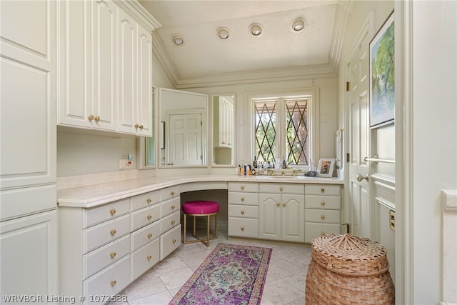 bathroom featuring crown molding, tile patterned flooring, vanity, and vaulted ceiling