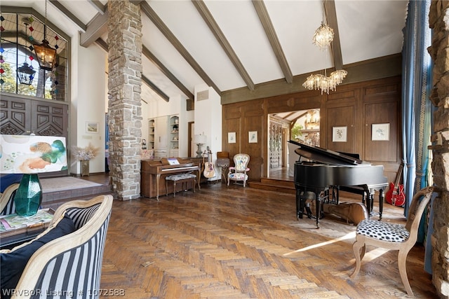 living area with dark parquet flooring, beam ceiling, high vaulted ceiling, a notable chandelier, and wood walls