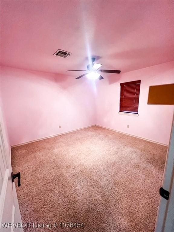 empty room with carpet flooring