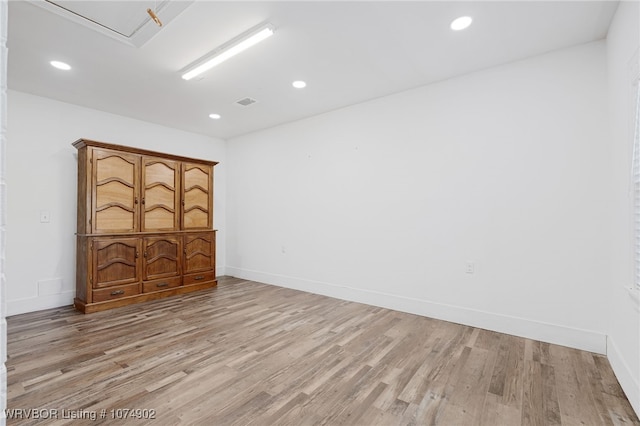 unfurnished room featuring light hardwood / wood-style floors