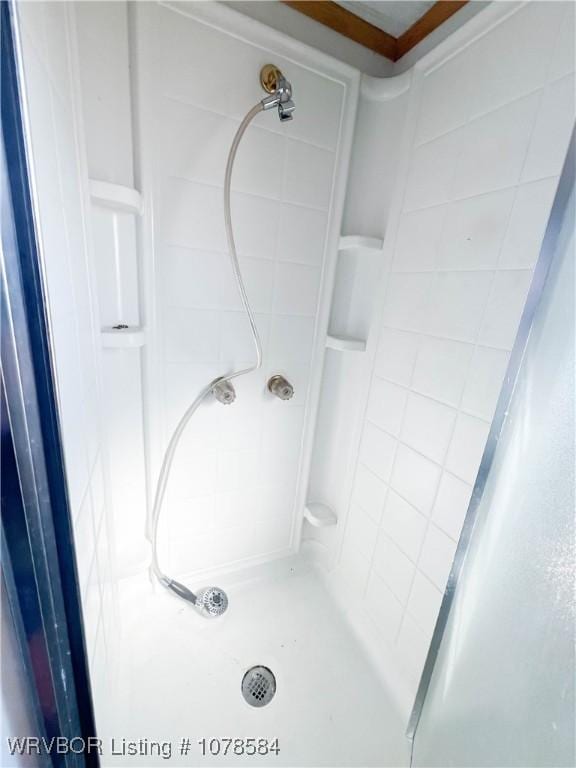 bathroom with a tile shower