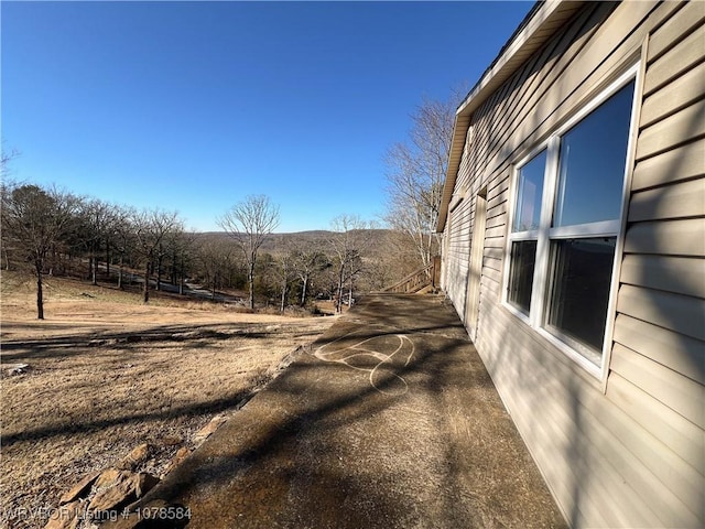 view of side of property with a mountain view