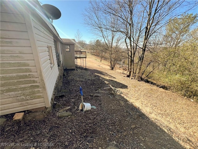 view of yard featuring a wooden deck