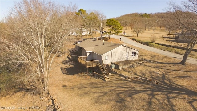 birds eye view of property with a rural view