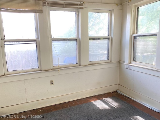 300 17th St, Fort Smith, AR 72901 - empty room featuring brick patterned floors and plenty of natural light