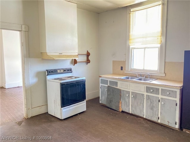300 17th St, Fort Smith, AR 72901 - kitchen featuring white electric range oven, a sink, dark wood-style floors, light countertops, and baseboards