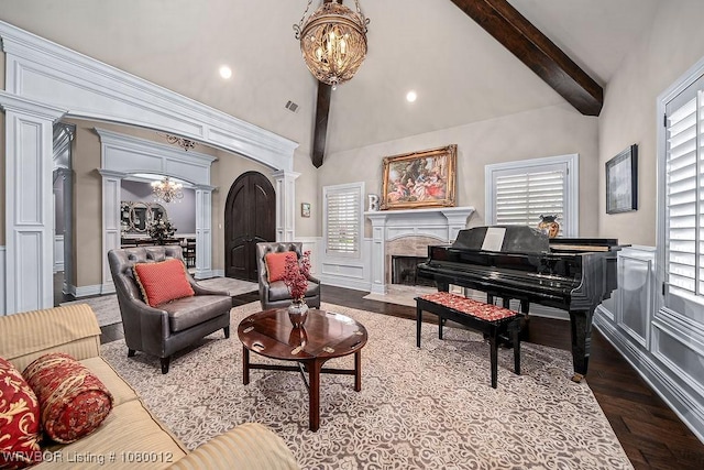 8200 Mile Tree Dr, Fort Smith, AR 72903 - living area with a notable chandelier, a decorative wall, decorative columns, beamed ceiling, and a premium fireplace