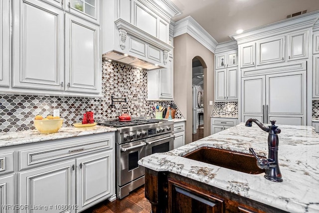 8200 Mile Tree Dr, Fort Smith, AR 72903 - kitchen with glass insert cabinets, visible vents, white cabinets, a sink, and high quality appliances