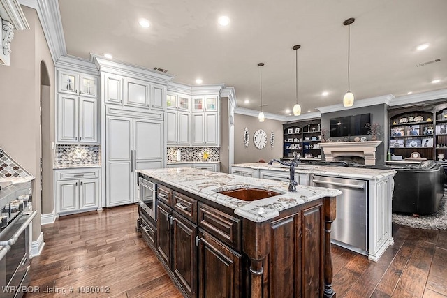 8200 Mile Tree Dr, Fort Smith, AR 72903 - kitchen with a sink, a fireplace, crown molding, a center island with sink, and stainless steel appliances