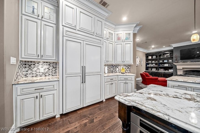 8200 Mile Tree Dr, Fort Smith, AR 72903 - kitchen with tasteful backsplash, dark wood-style flooring, ornamental molding, glass insert cabinets, and light stone countertops