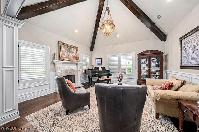 8200 Mile Tree Dr, Fort Smith, AR 72903 - living room with visible vents, lofted ceiling with beams, dark wood finished floors, a wainscoted wall, and a glass covered fireplace