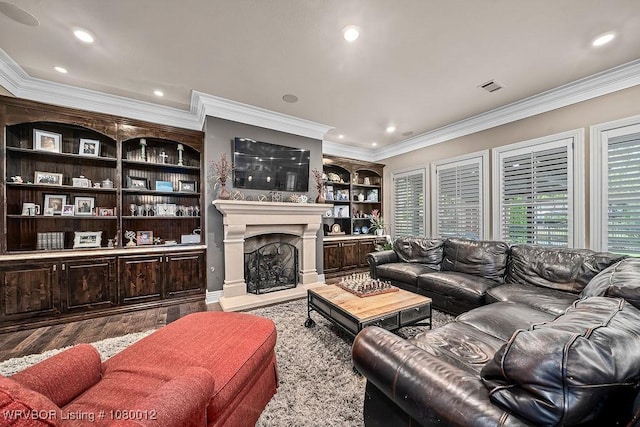 8200 Mile Tree Dr, Fort Smith, AR 72903 - living area with crown molding, visible vents, a fireplace with raised hearth, and wood finished floors
