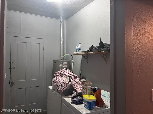436 N Pine St, Waldron, AR 72958 - laundry room featuring washing machine and dryer, laundry area, water heater, and a textured wall