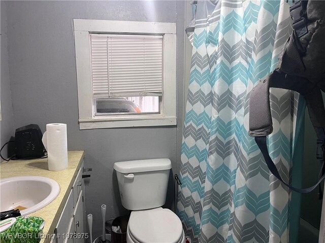 436 N Pine St, Waldron, AR 72958 - bathroom with a shower with curtain, vanity, and toilet