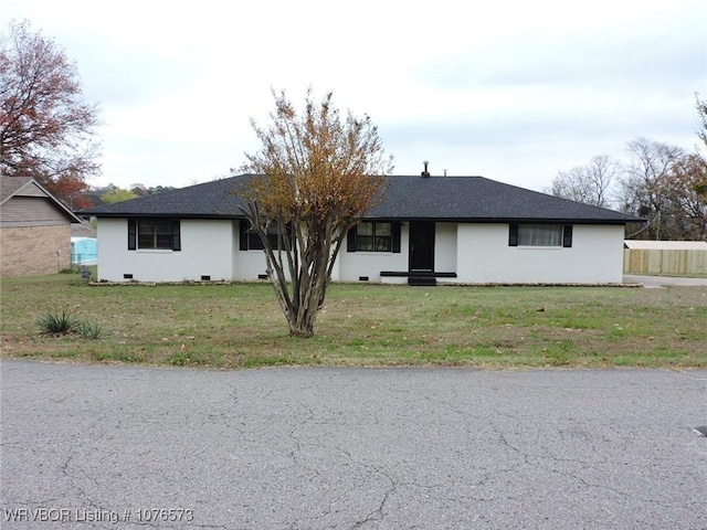 ranch-style home featuring a front yard