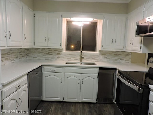 kitchen with black dishwasher, sink, white cabinetry, and range with electric cooktop