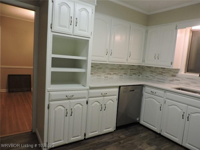 kitchen featuring dark hardwood / wood-style flooring, tasteful backsplash, stainless steel dishwasher, sink, and white cabinetry