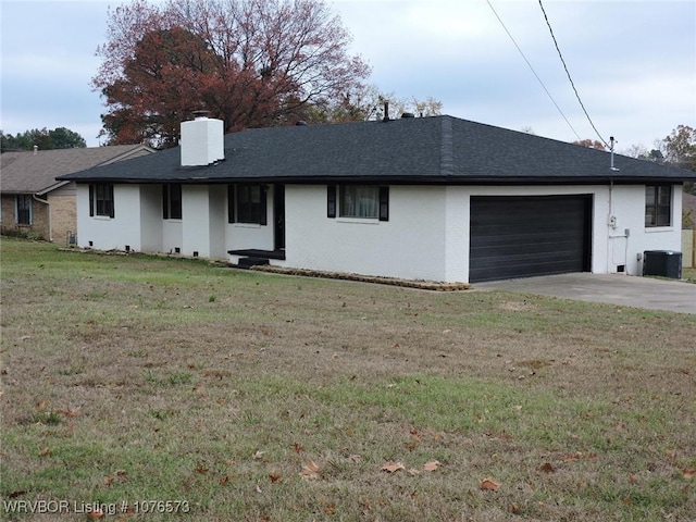 single story home with a garage and a front yard