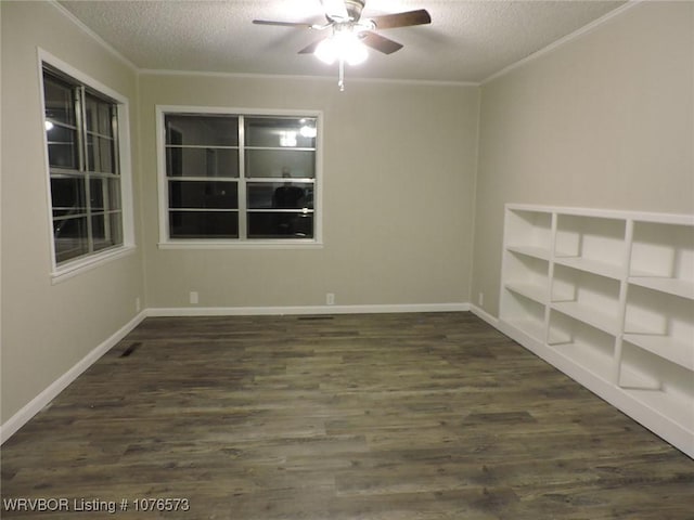 unfurnished room with ornamental molding, a textured ceiling, ceiling fan, and dark wood-type flooring