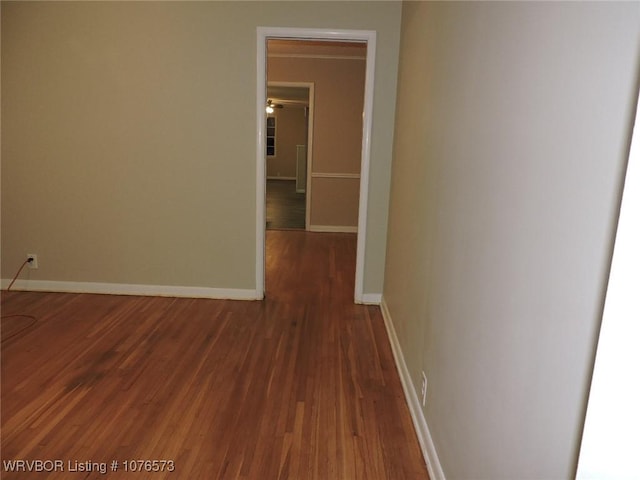 corridor with dark wood-type flooring