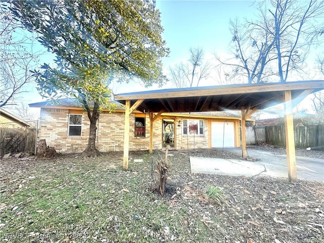 view of front facade with a carport and a garage