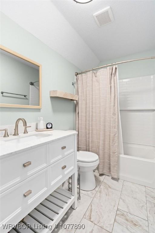 full bathroom featuring vanity, toilet, lofted ceiling, and shower / tub combo with curtain