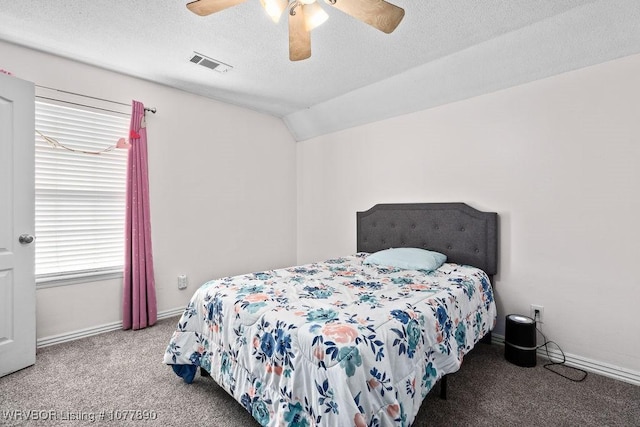 bedroom featuring carpet, ceiling fan, lofted ceiling, and a textured ceiling