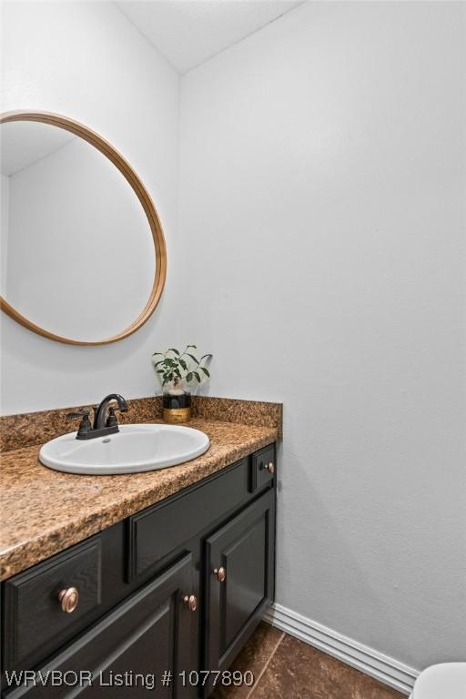 bathroom with tile patterned flooring and vanity