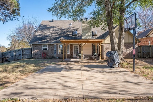 back of property featuring a patio area