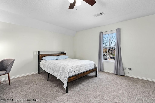 carpeted bedroom featuring ceiling fan and lofted ceiling