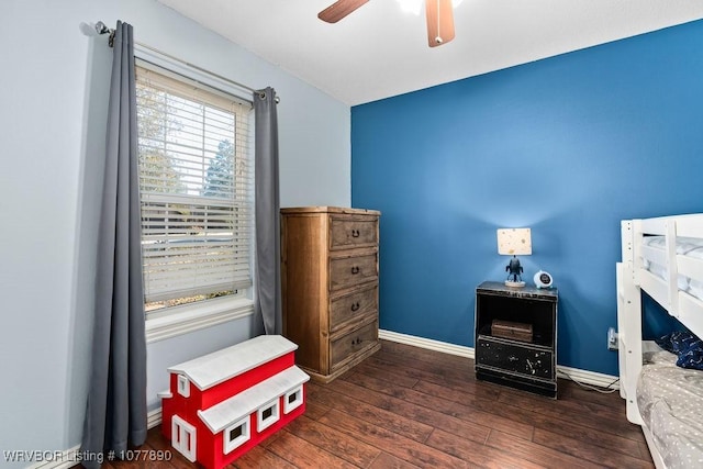 living area with dark hardwood / wood-style floors and ceiling fan